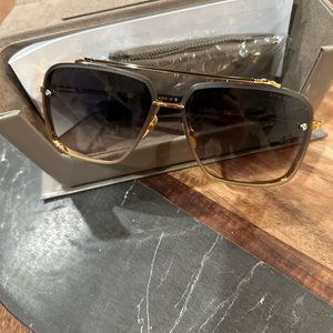 Brand new Dita Mach Six Gold with gray lenses….never worn.